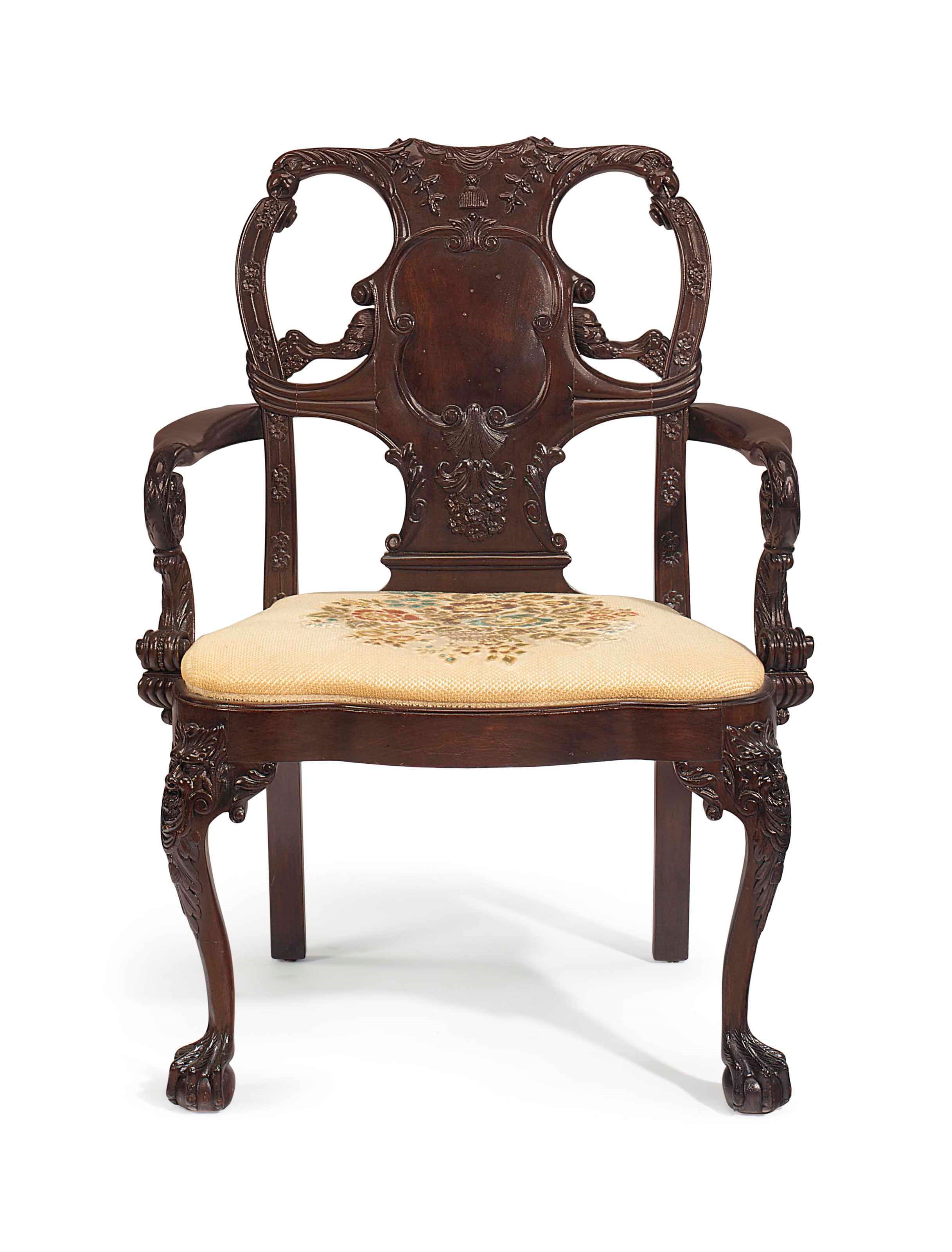 A GEORGE II STYLE MAHOGANY ARMCHAIR