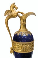 A PAIR OF EMPIRE ORMOLU AND ENAMEL EWERS