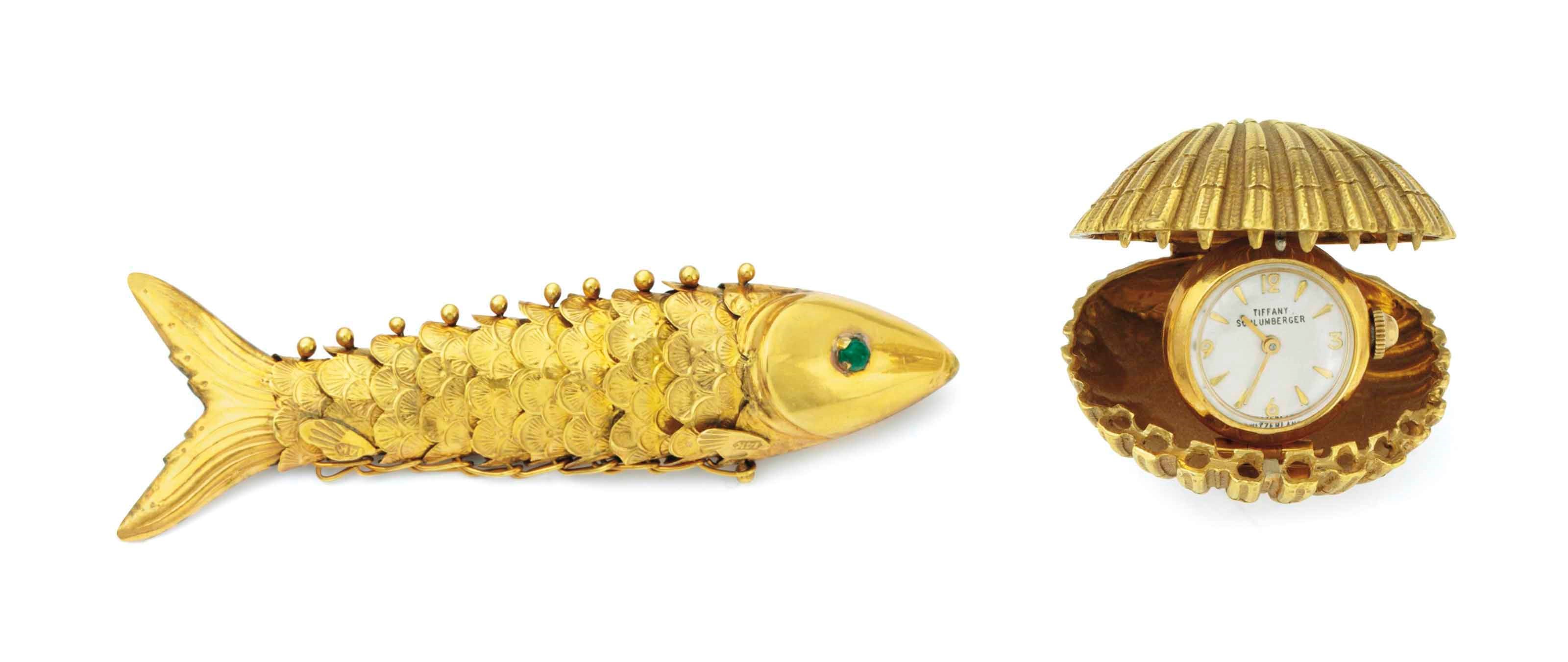 AN 18K GOLD SHELL CLOCK