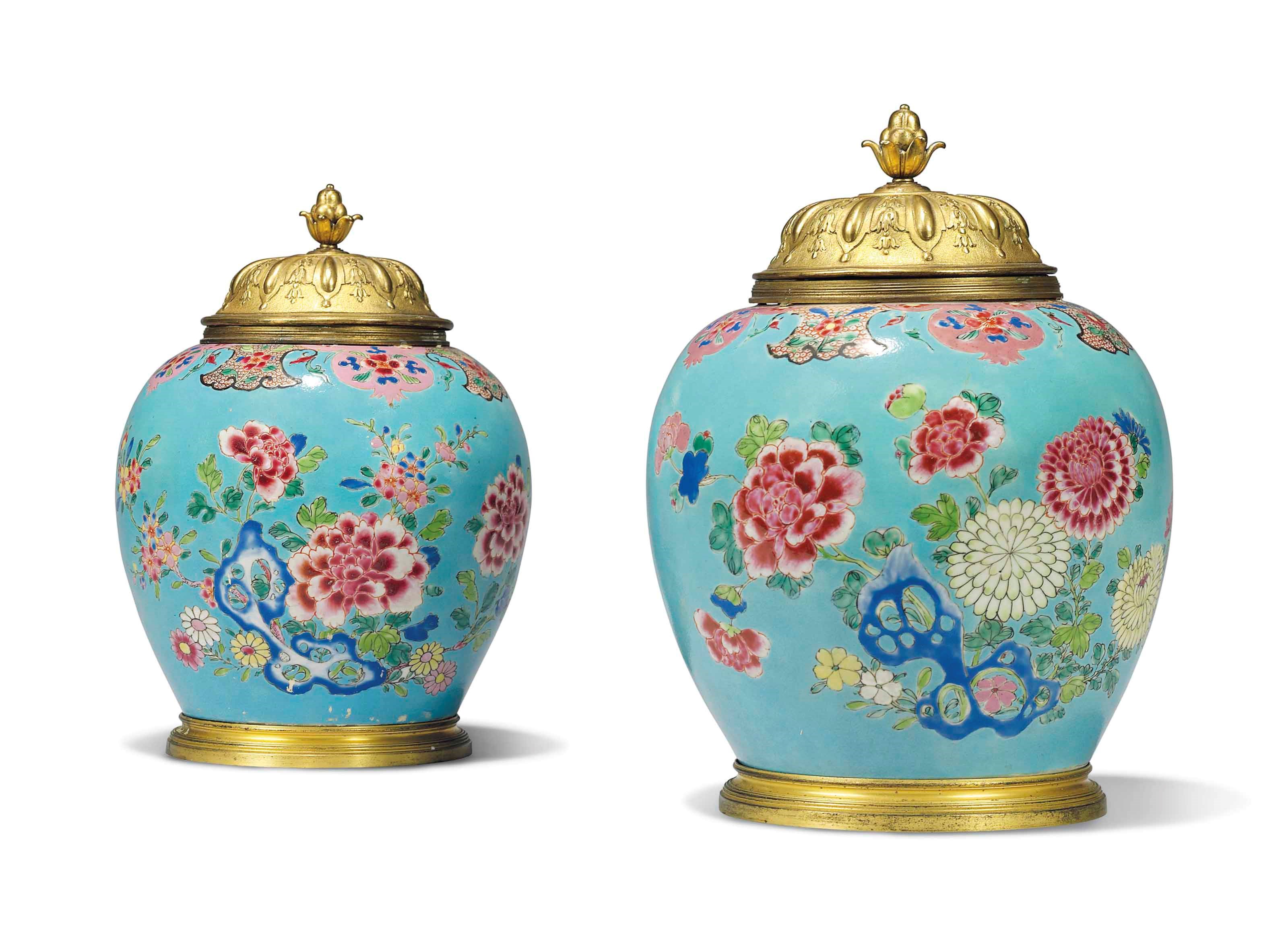 A NEAR PAIR OF ORMOLU-MOUNTED CHINESE FAMILLE ROSE OVIFORM VASES