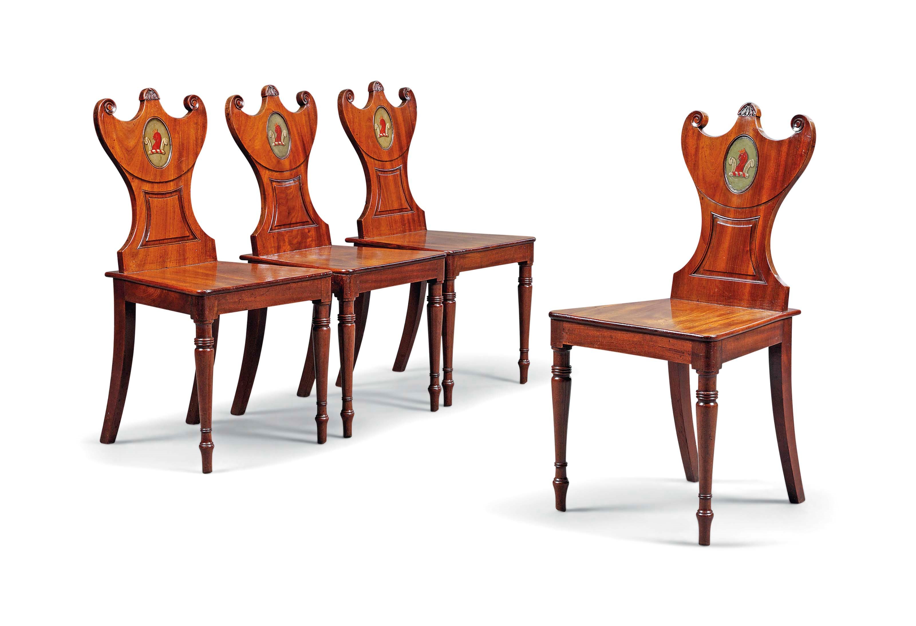 A SET OF FOUR REGENCY MAHOGANY HALL CHAIRS