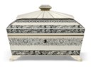 AN ANGLO-INDIAN ENGRAVED IVORY, HORN AND SANDALWOOD SARCOPHAGUS-SHAPED WORK BOX