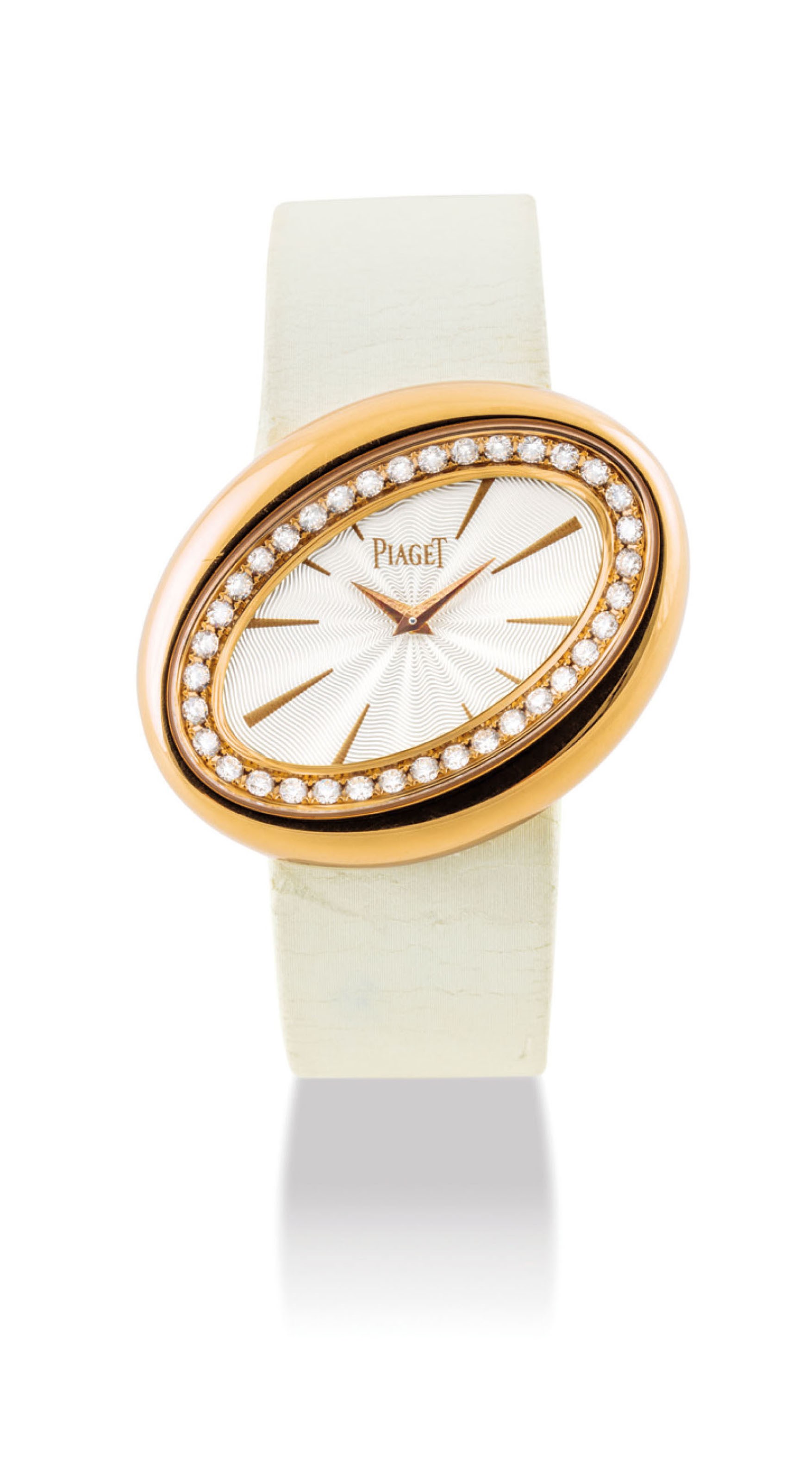 PIAGET. A LADY’S UNUSUAL 18K GOLD AND DIAMOND-SET OVAL WRISTWATCH WITH ROTATING CASE