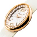 PIAGET. A LADY’S UNUSUAL 18K GOLD AND DIAMOND-SET OVAL WRISTWATCH WITH ROTATING CASE