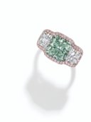 A RARE COLORED DIAMOND AND DIAMOND RING