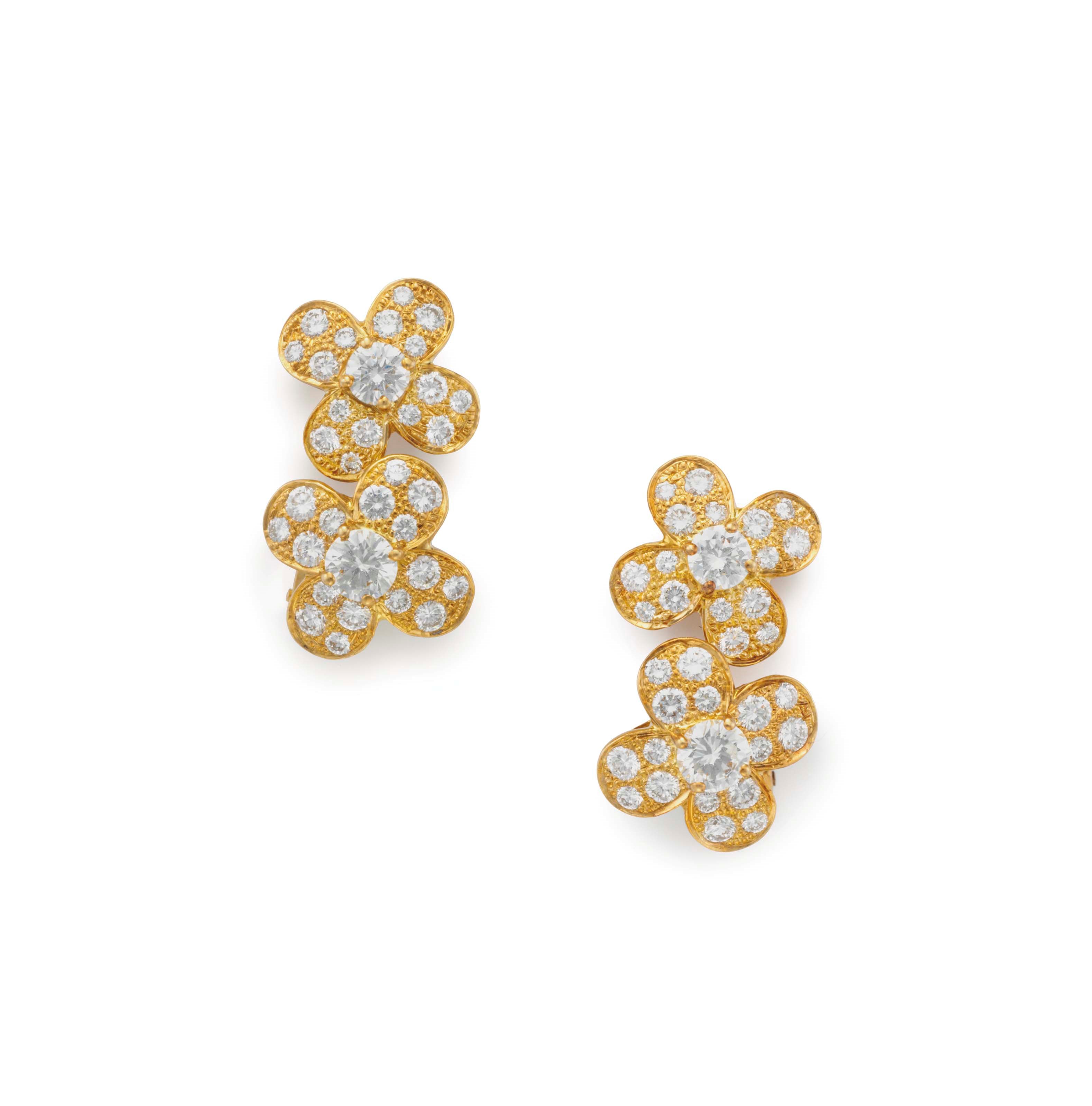 A PAIR OF DIAMOND AND GOLD FLOWER EAR CLIPS, BY VAN CLEEF & ARPELS