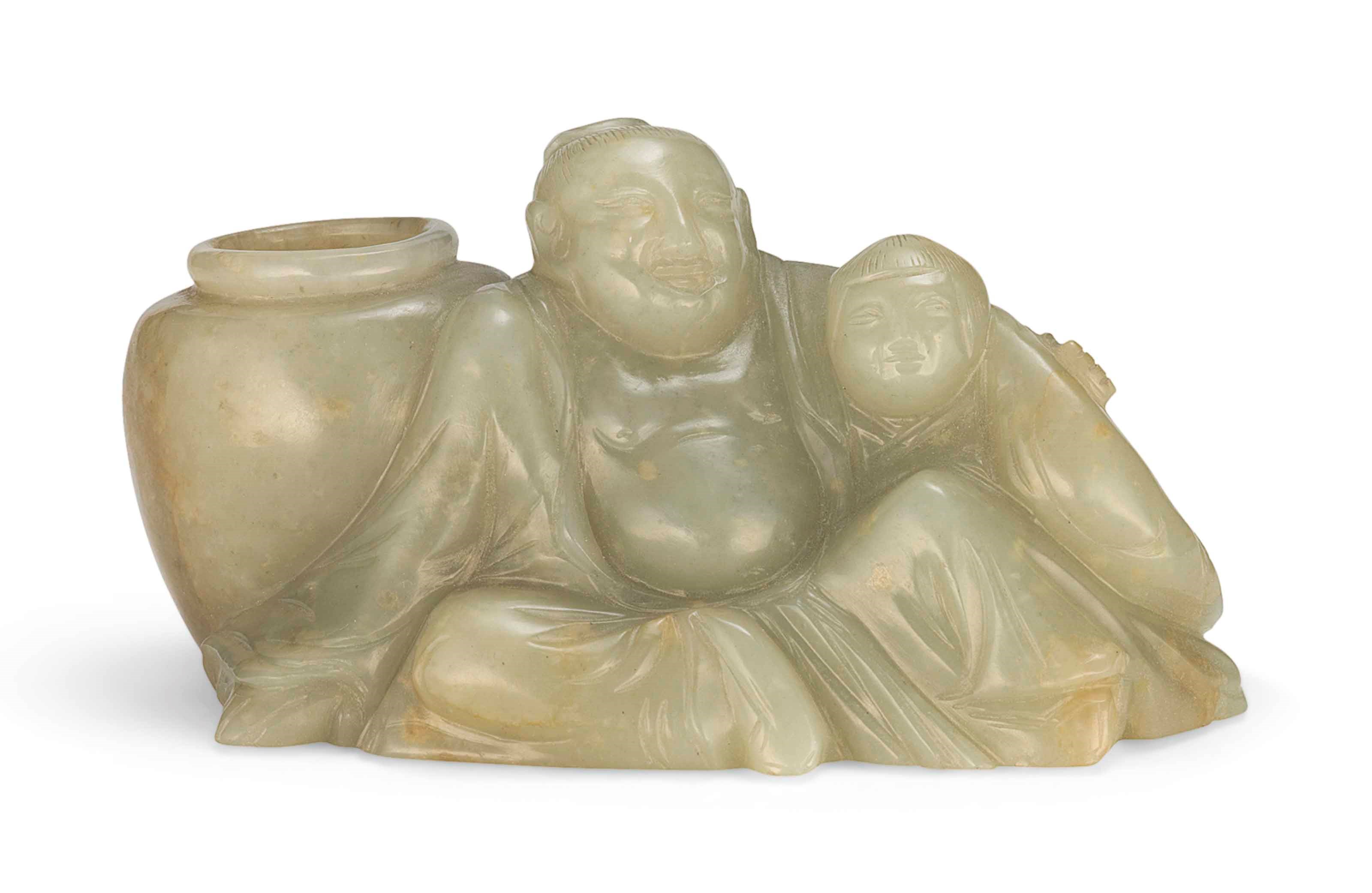 A CHINESE CELADON JADE FIGURAL GROUP