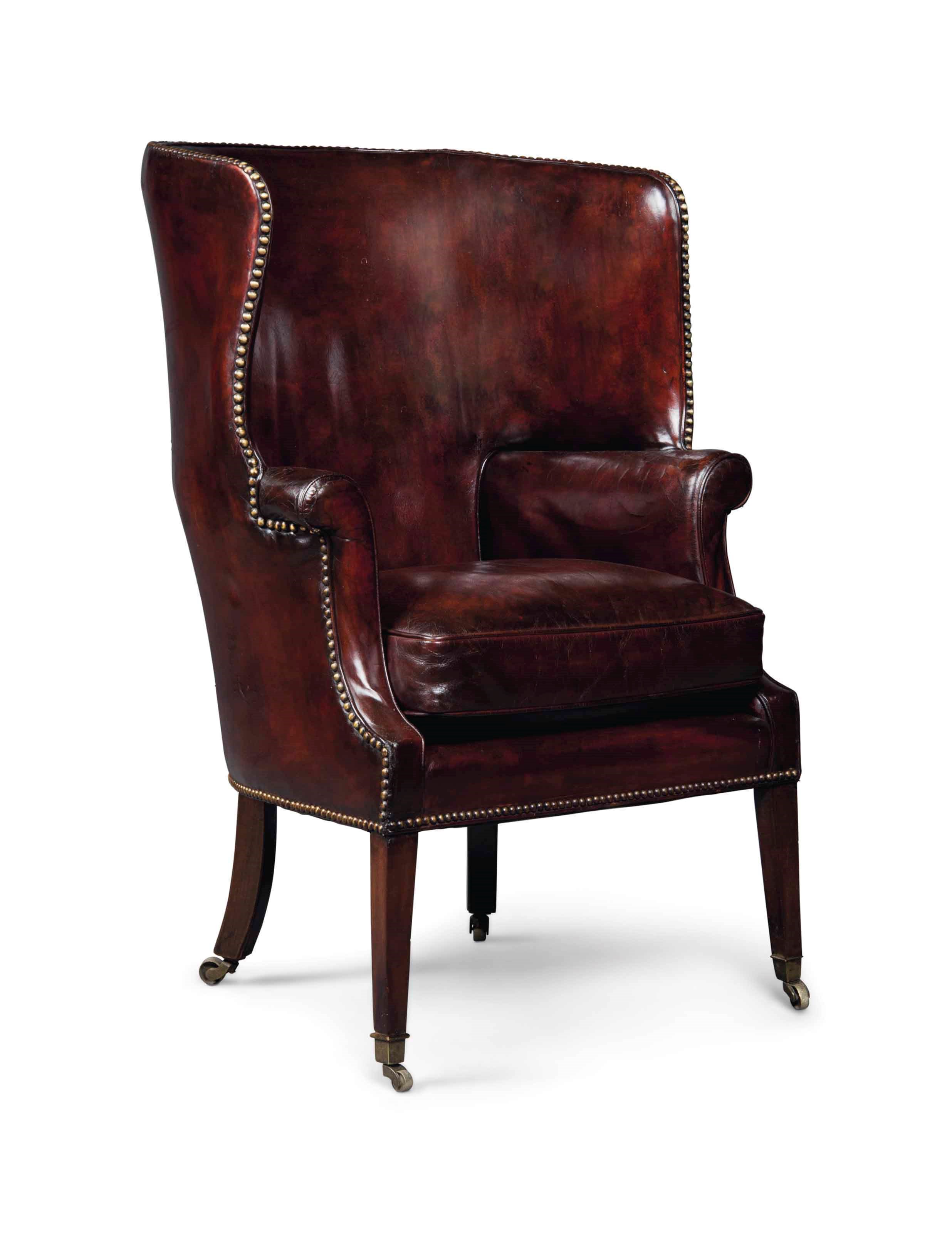 A MAHOGANY WING ARMCHAIR