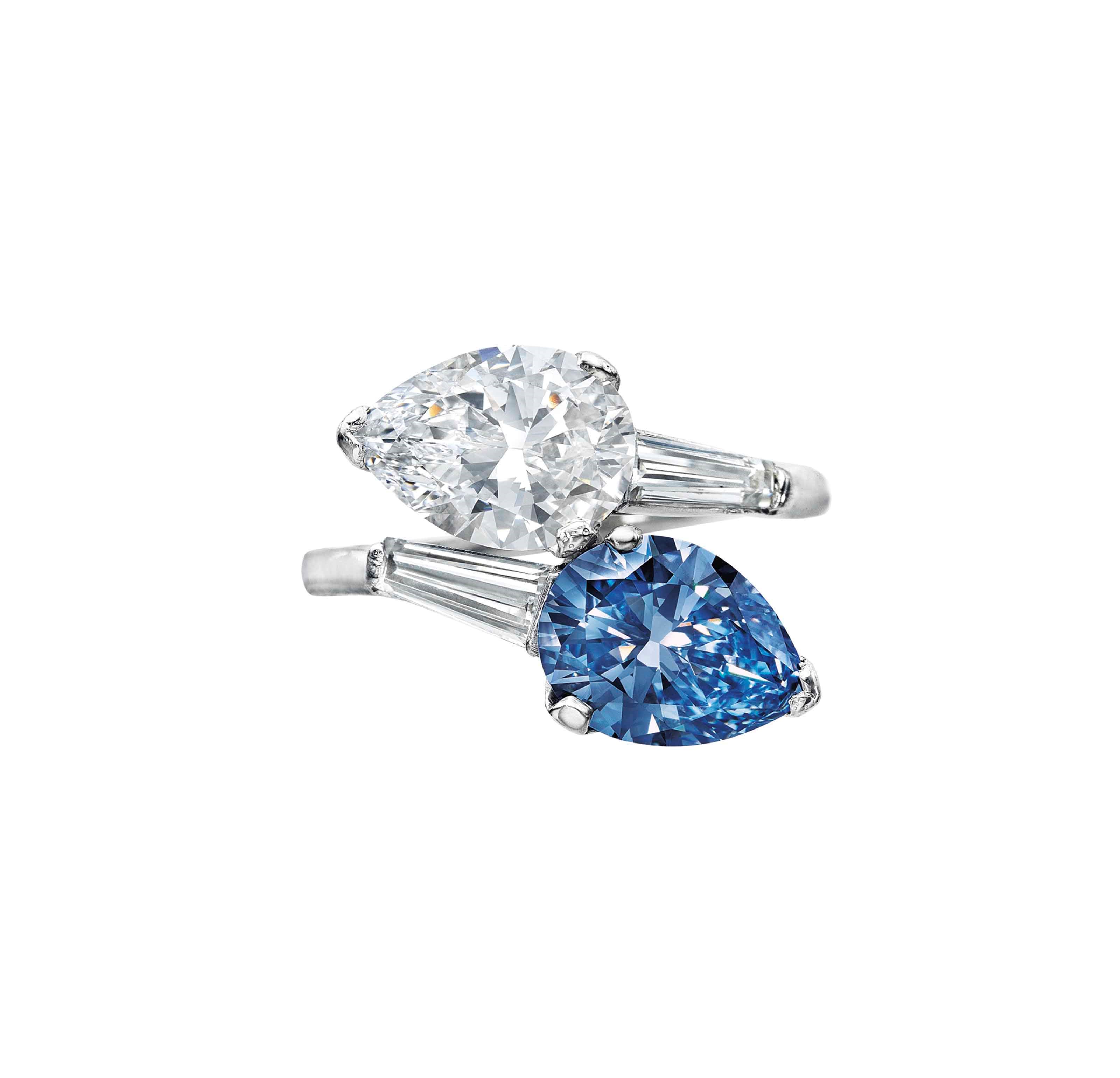 A SUPERB TWIN-STONE COLORED DIAMOND AND DIAMOND RING