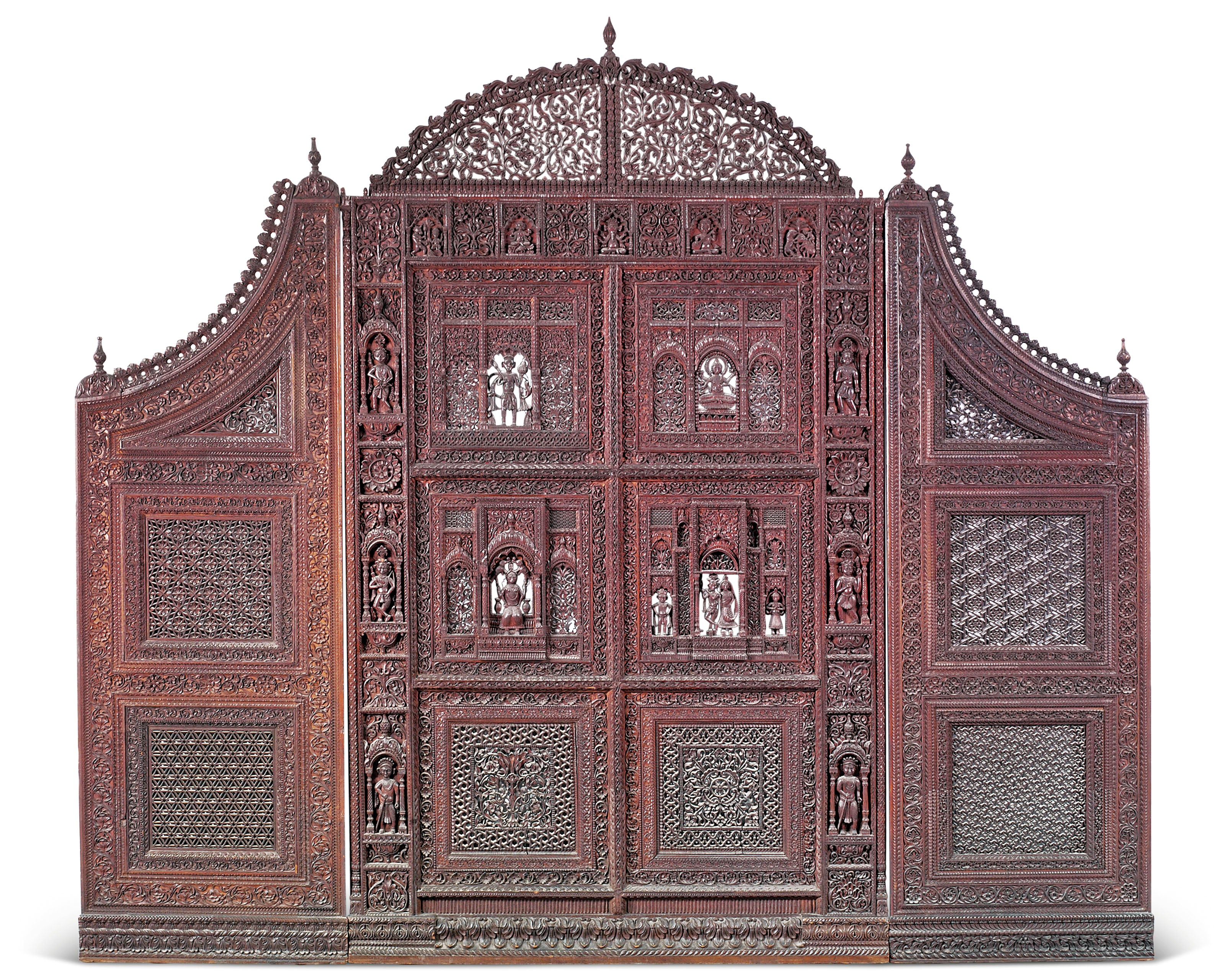 A LARGE DARK WOOD OPENWORK SCREEN