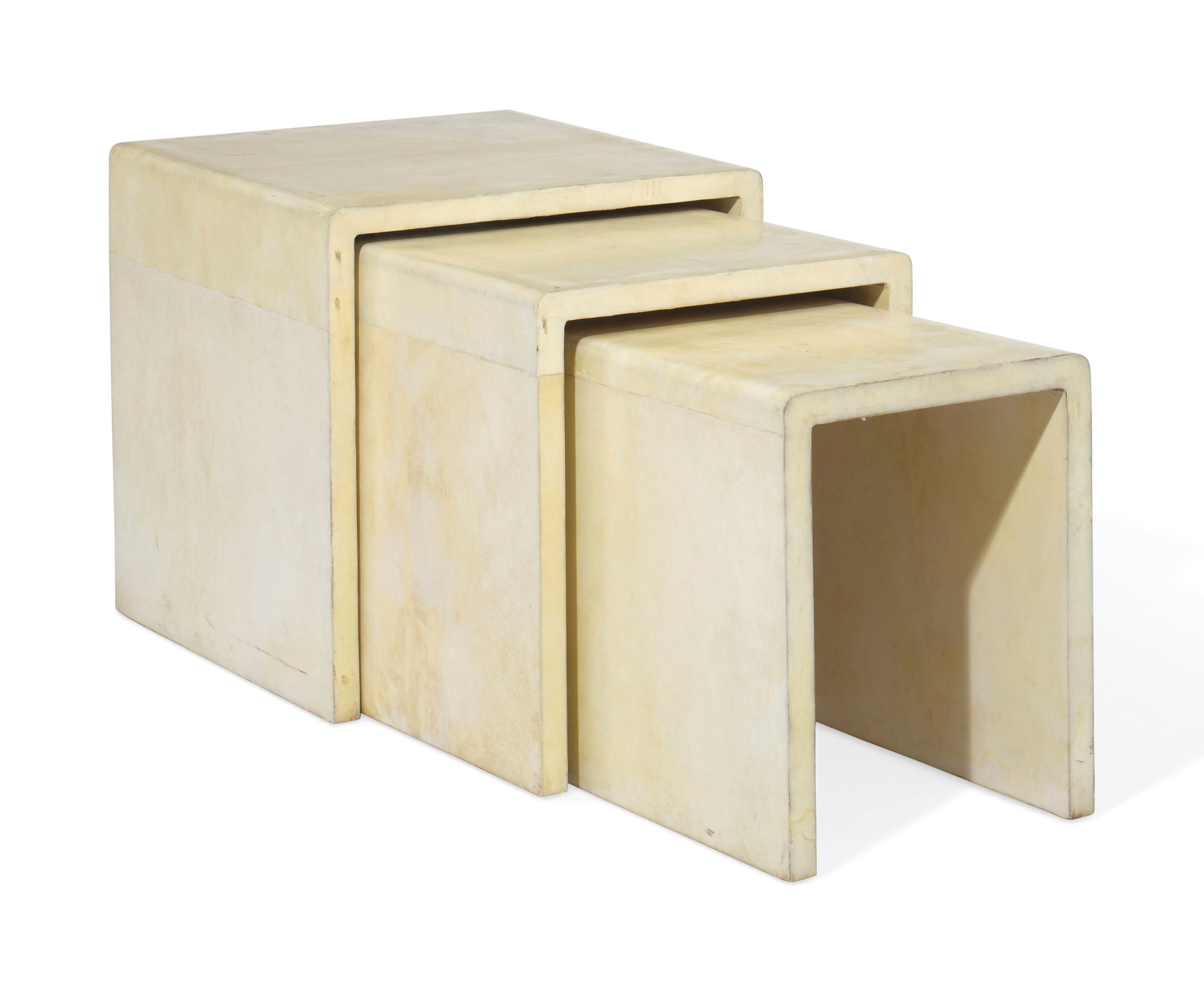 A SET OF THREE PARCHMENT-VENEERED NESTING TABLES