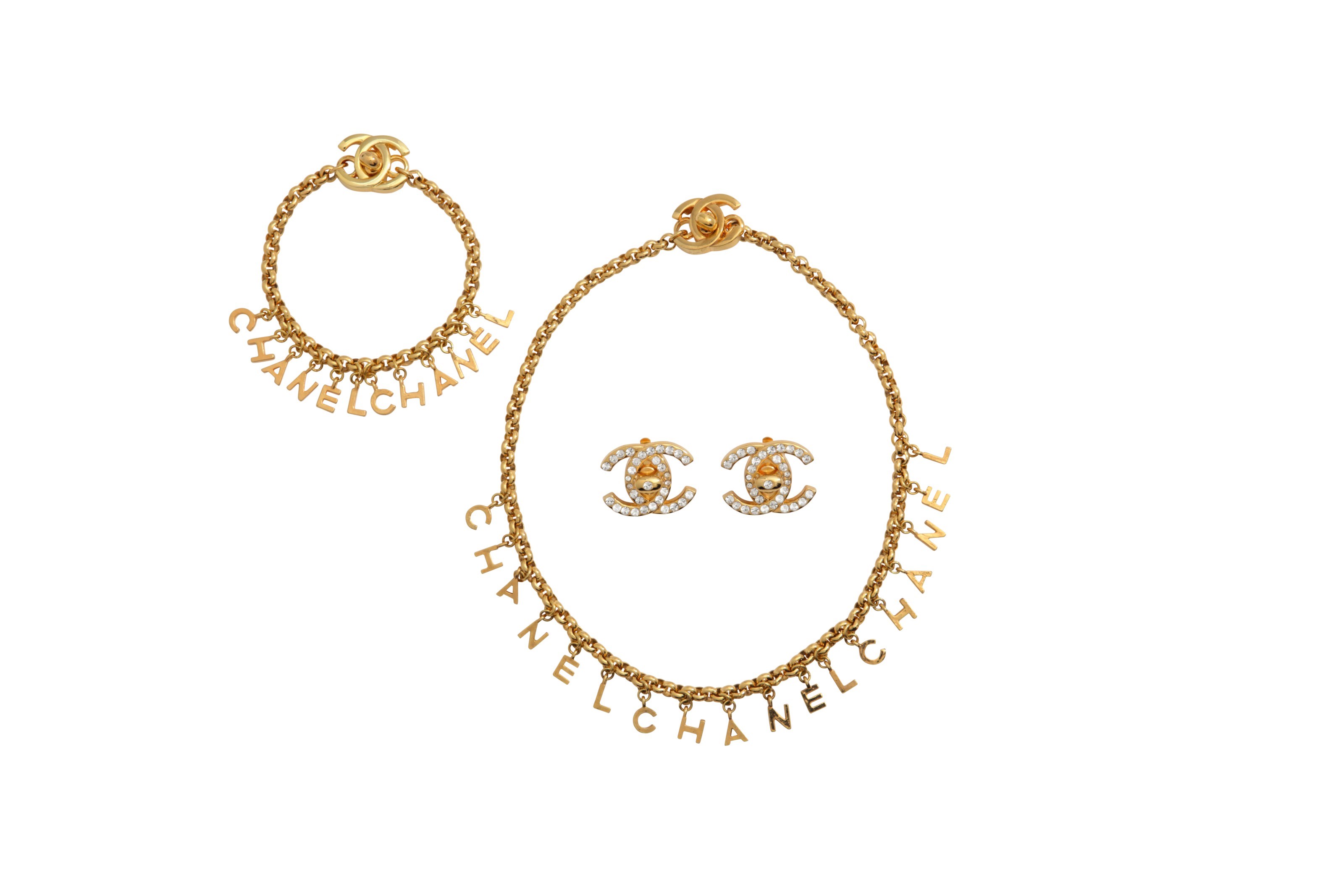 A SET OF THREE GOLD METAL & CRYSTAL JEWELRY