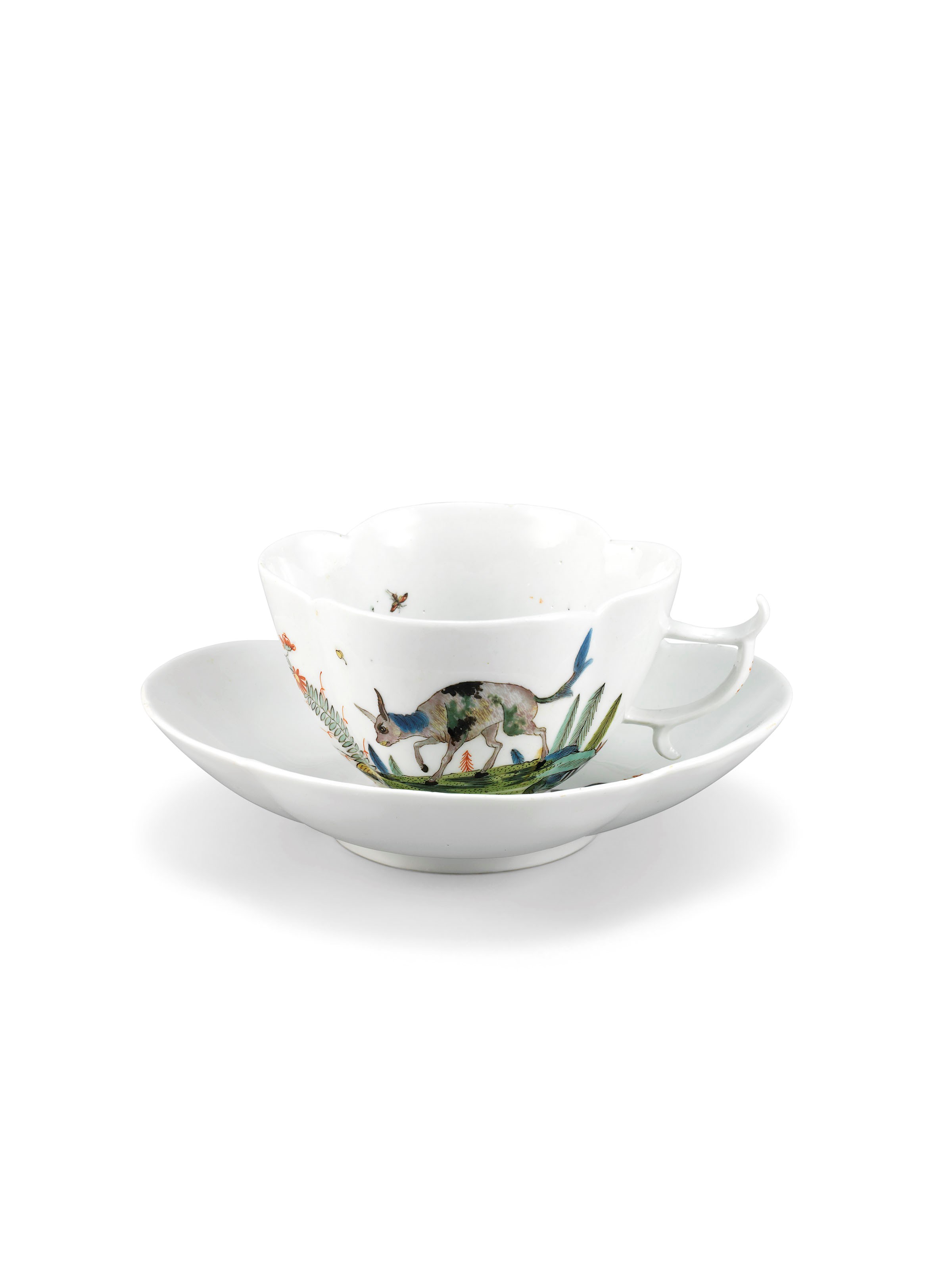 A MEISSEN PORCELAIN FABELTIERE QUATREFOIL CUP AND SAUCER