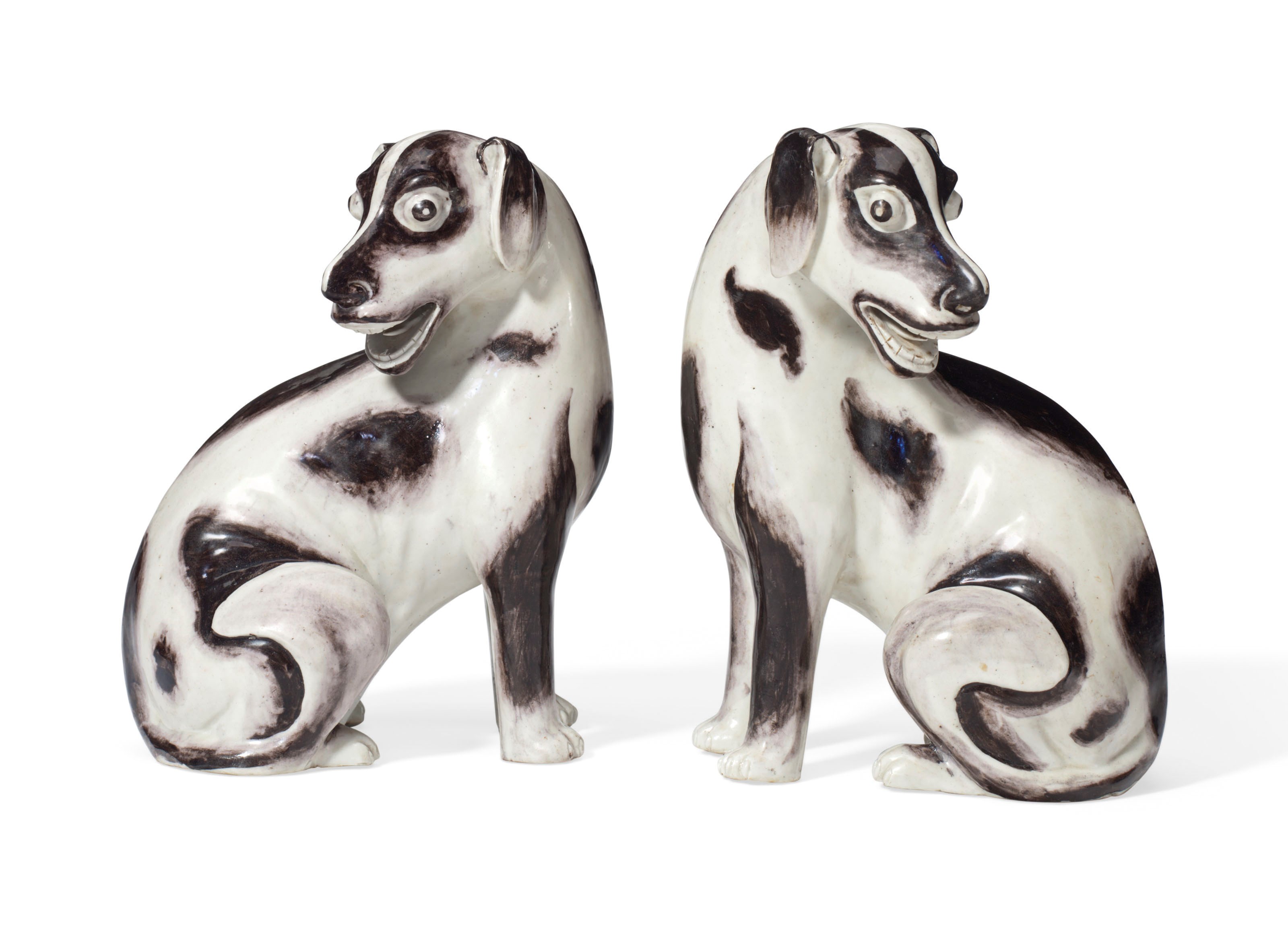 AN UNUSUAL PAIR OF CHINESE EXPORT SEATED HOUNDS