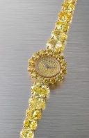 GRAFF. A MAGNIFICENT 18K GOLD AND FANCY VIVID YELLOW DIAMOND SET LADY’S QUARTZ WRISTWATCH WITHINTEGRAL FANCY VIVID YELLOW DIAMOND SET BRACELET AND BOX