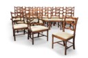 A SET OF SIXTEEN GEORGE III MAHOGANY `FIDDLE-BACK' DINING-CHAIRS