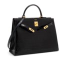 A SHINY BLACK NILOTICUS CROCODILE SELLIER KELLY 35 WITH GOLD HARDWARE