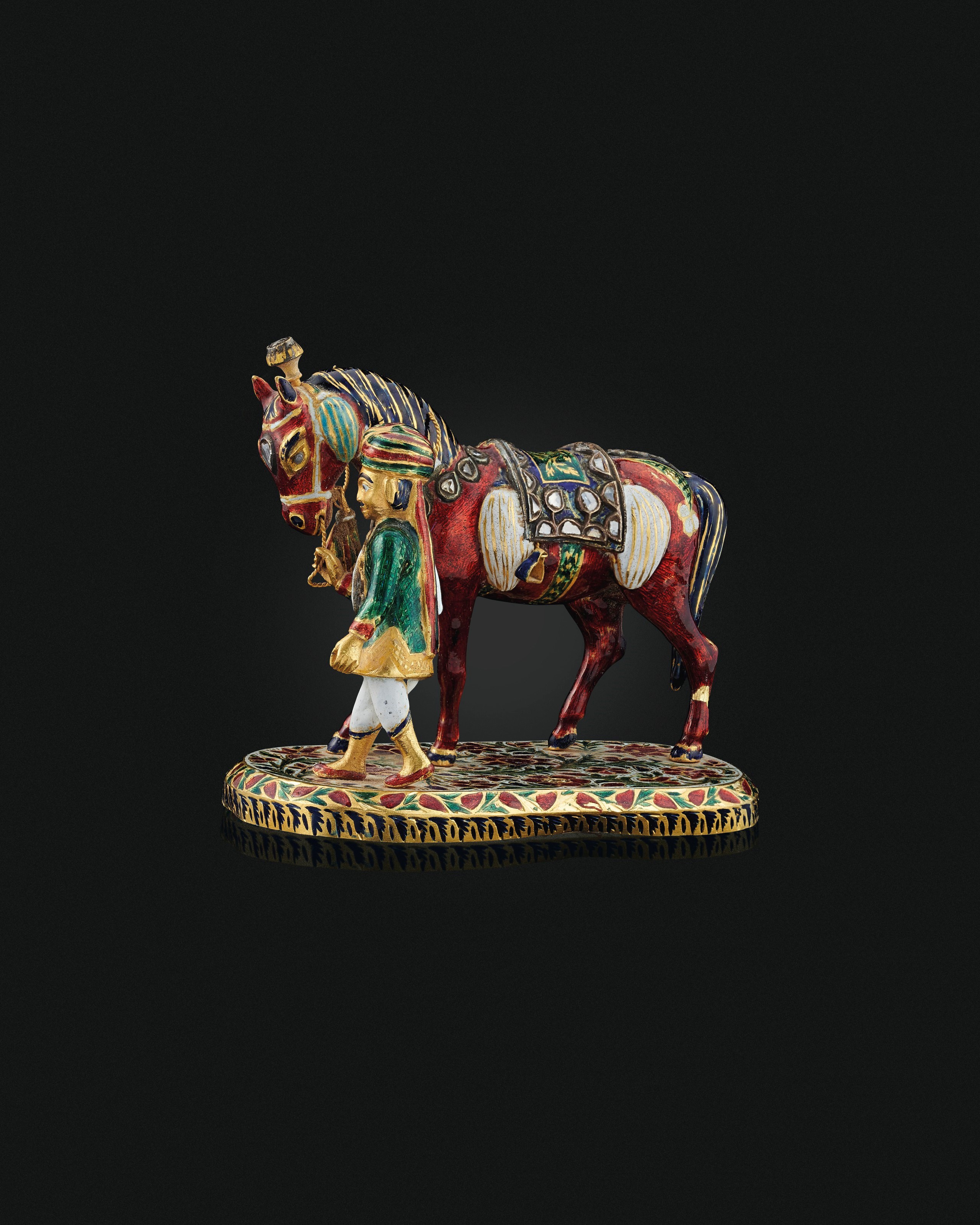 AN ENAMELLED AND DIAMOND-SET MODEL OF A HORSE AND GROOM
