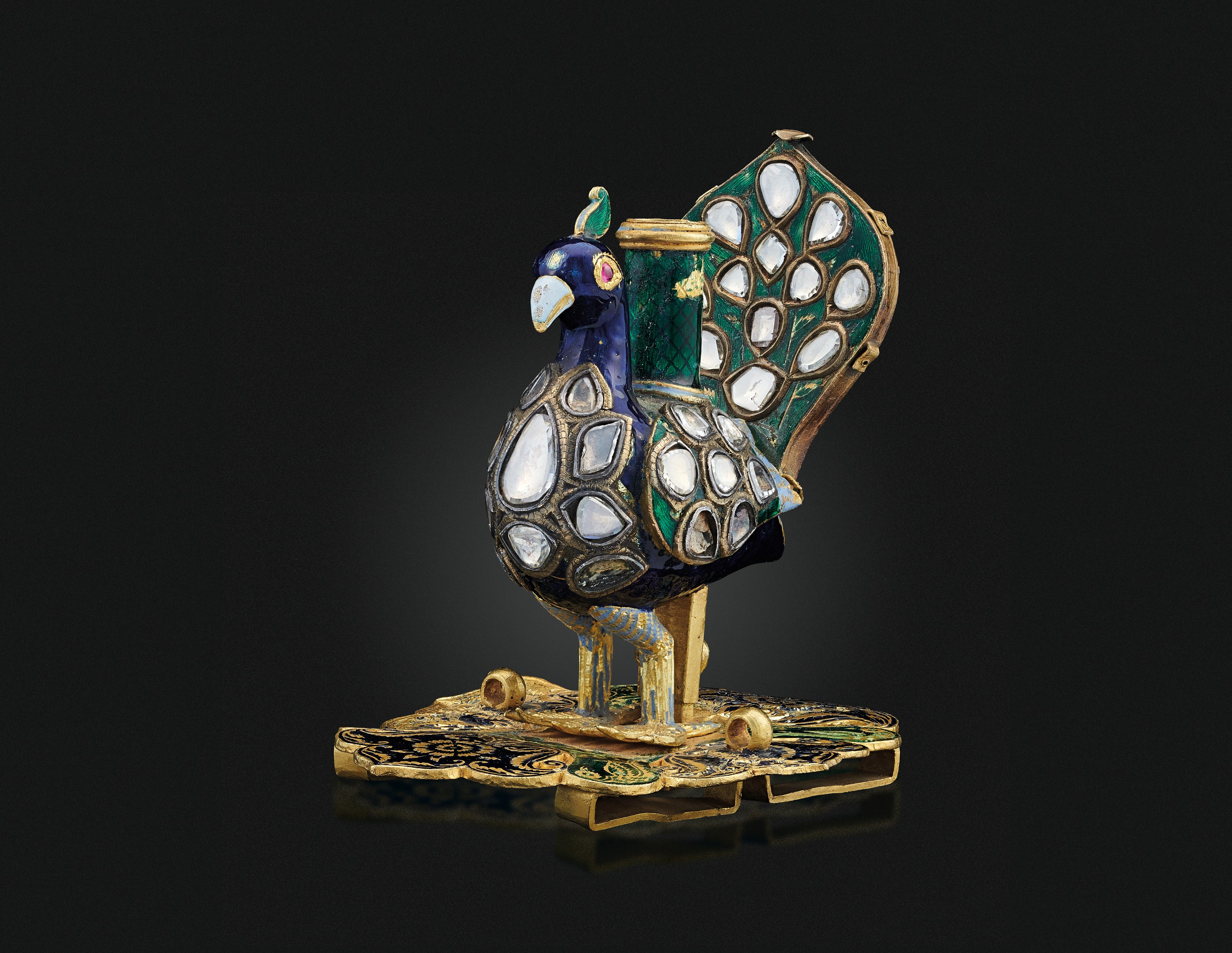 AN ENAMELLED AND GEM SET PEACOCK FITTING