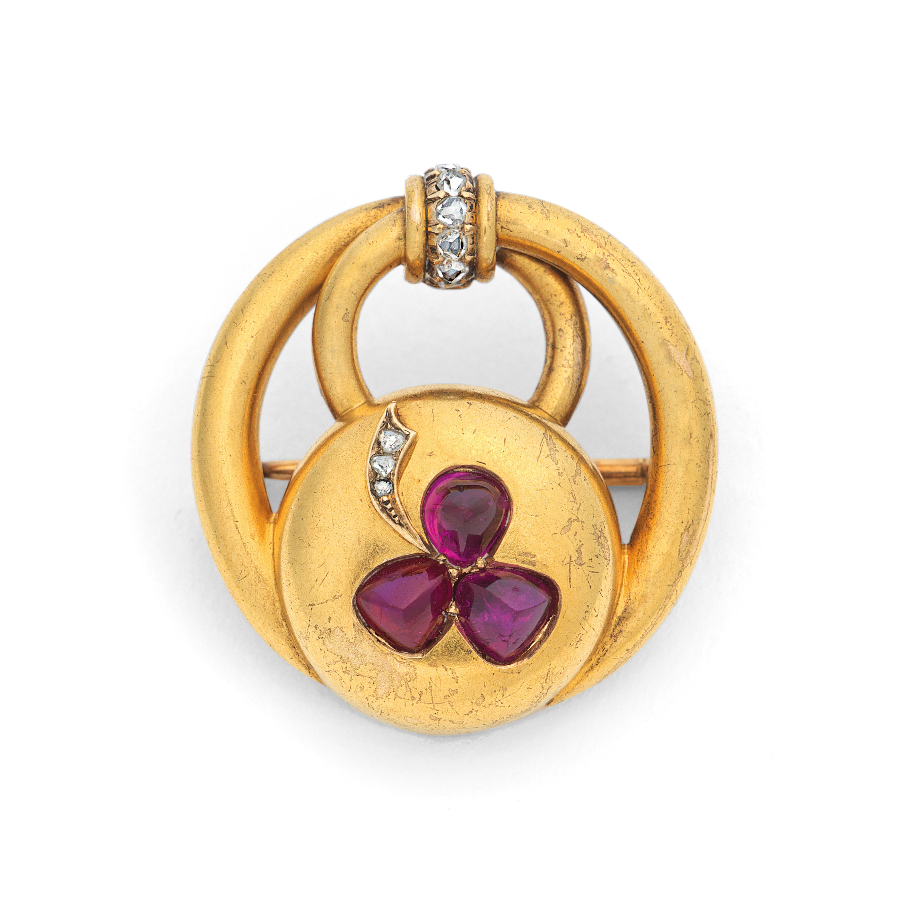 A JEWELLED GOLD BROOCH