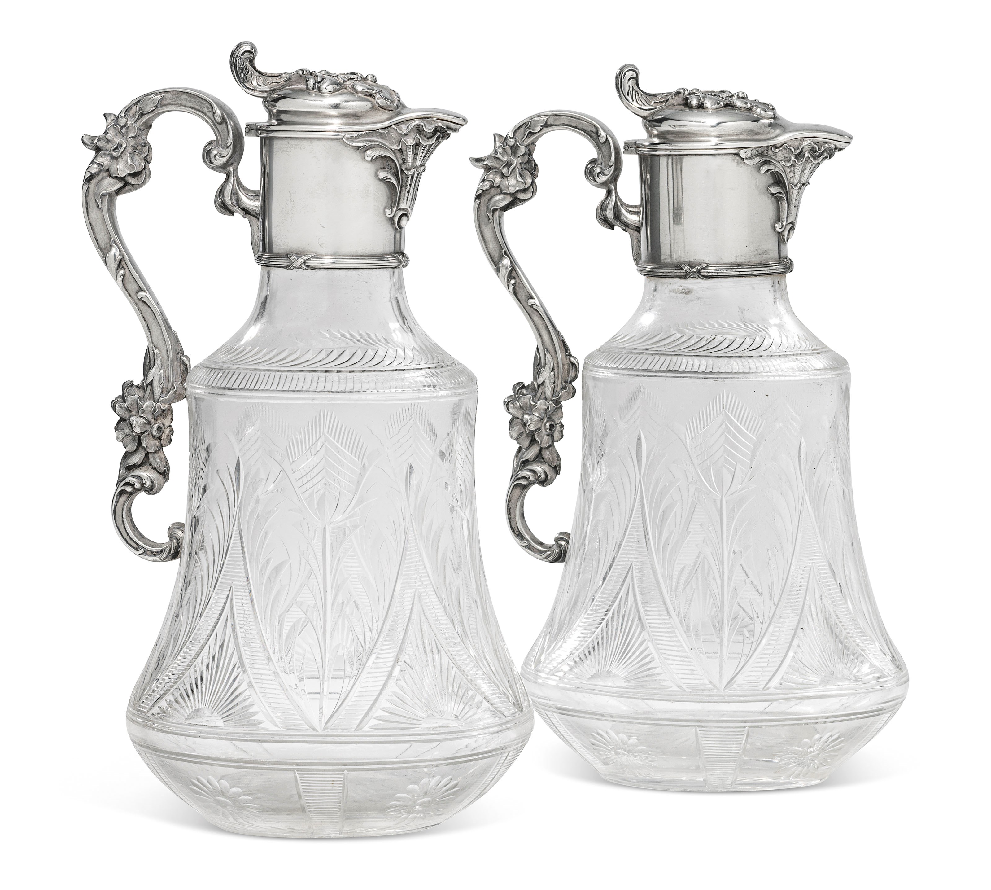 A PAIR OF PARCEL-GILT SILVER-MOUNTED CUT-GLASS DECANTERS