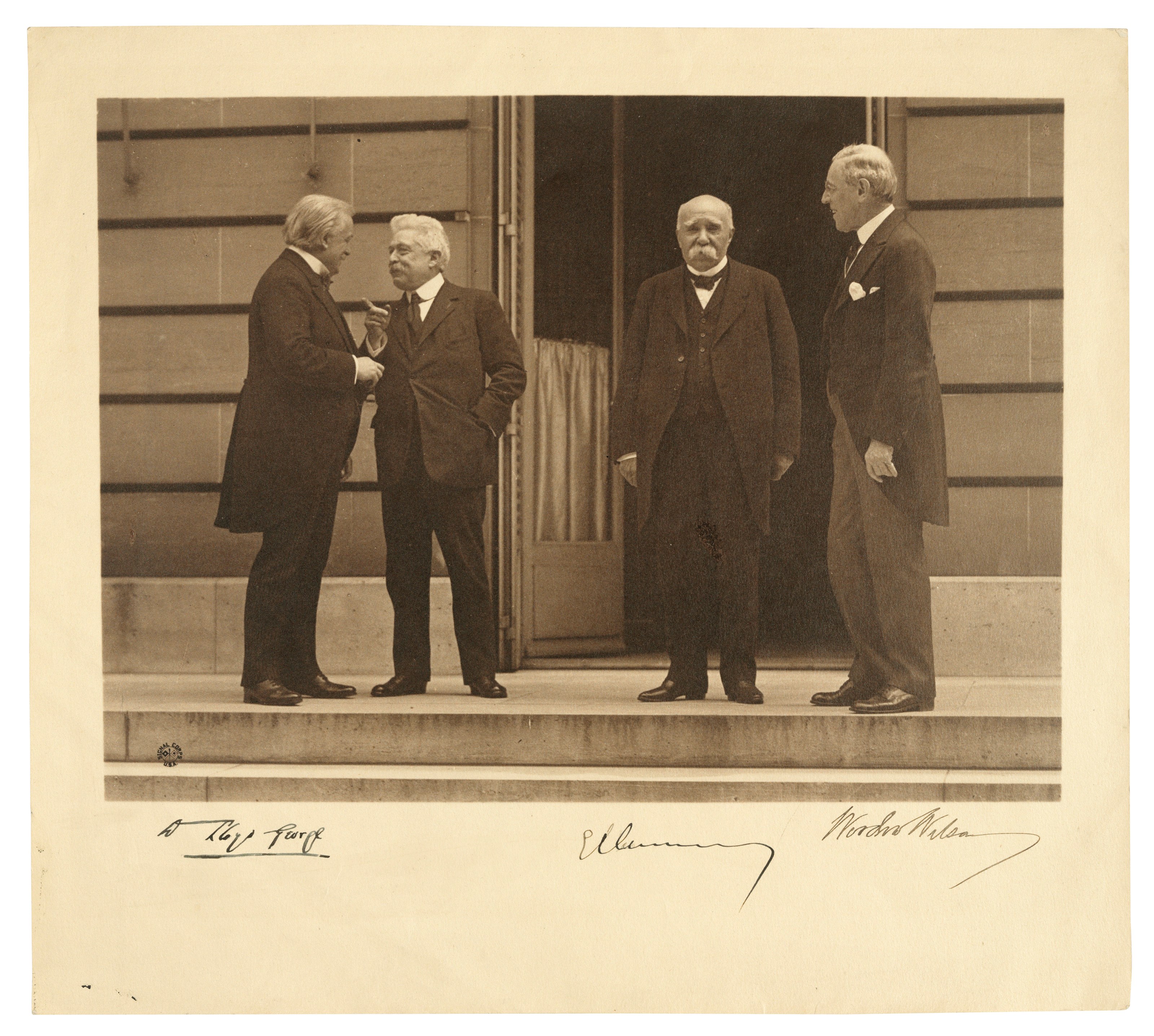WORLD WAR I – COUNCIL OF FOUR. Photograph signed by David Lloyd George (‘D Lloyd George’), Georges Clemenceau (‘G Clemenceau’) and Woodrow Wilson (‘Woodrow Wilson’), n.p. [Versailles], n.d. [1919].