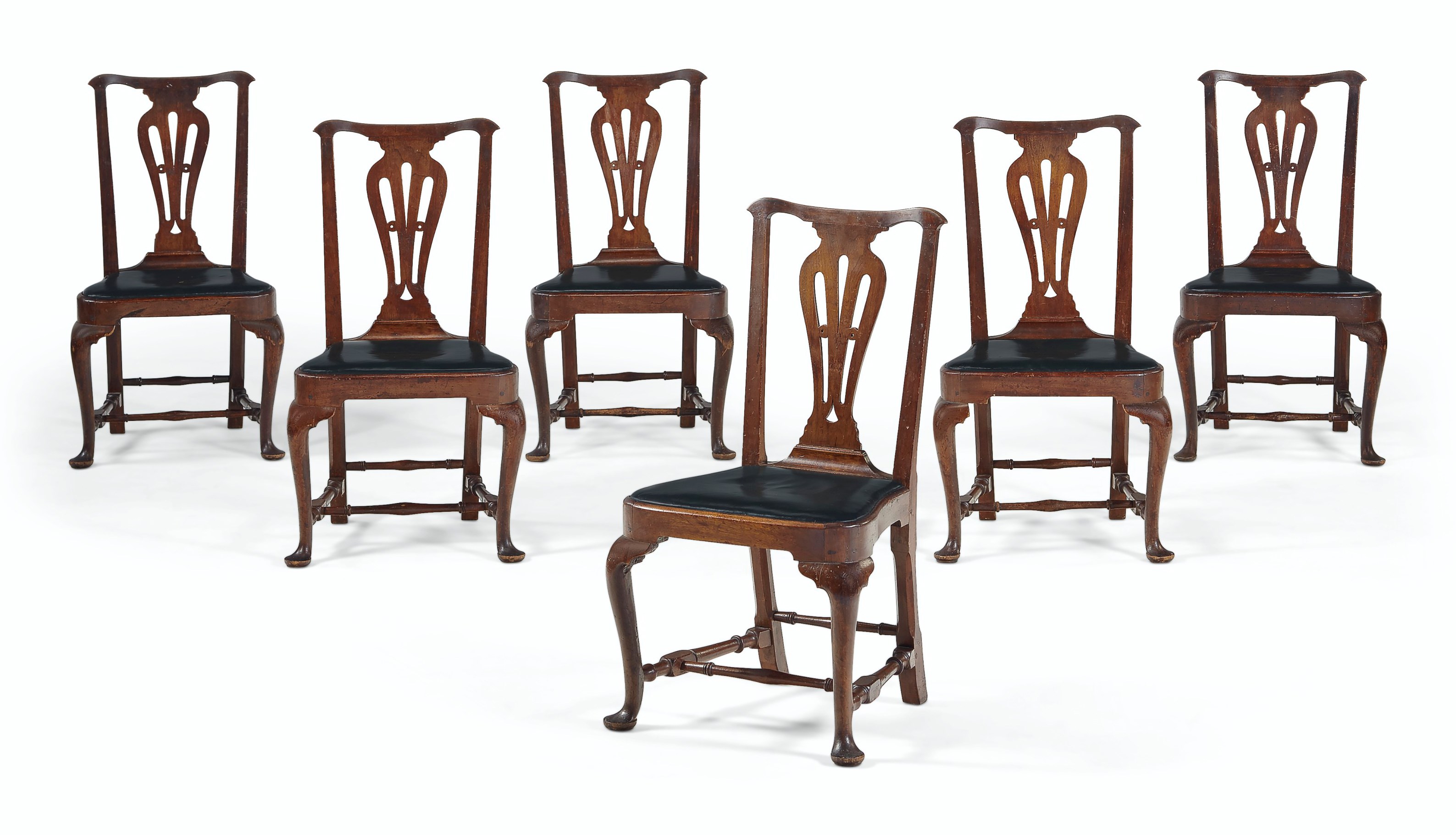 A SET OF SIX CHIPPENDALE WALNUT SIDE CHAIRS TOGETHER WITH THREE CHAIRS OF THE SAME DESIGN