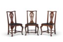 A SET OF SIX CHIPPENDALE WALNUT SIDE CHAIRS TOGETHER WITH THREE CHAIRS OF THE SAME DESIGN