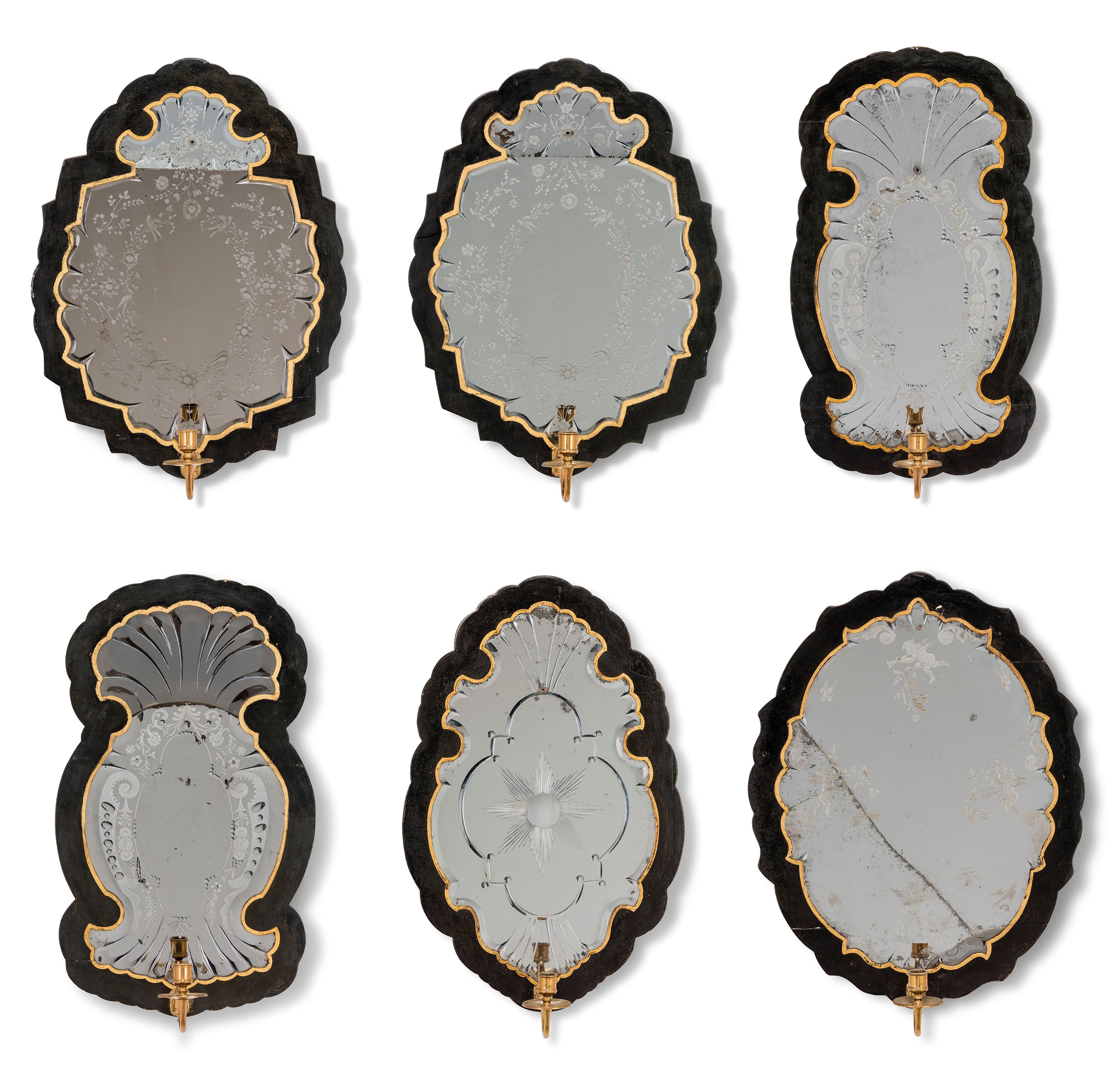 SEVEN ITALIAN EBONISED AND PARCEL-GILT GIRANDOLE MIRRORS