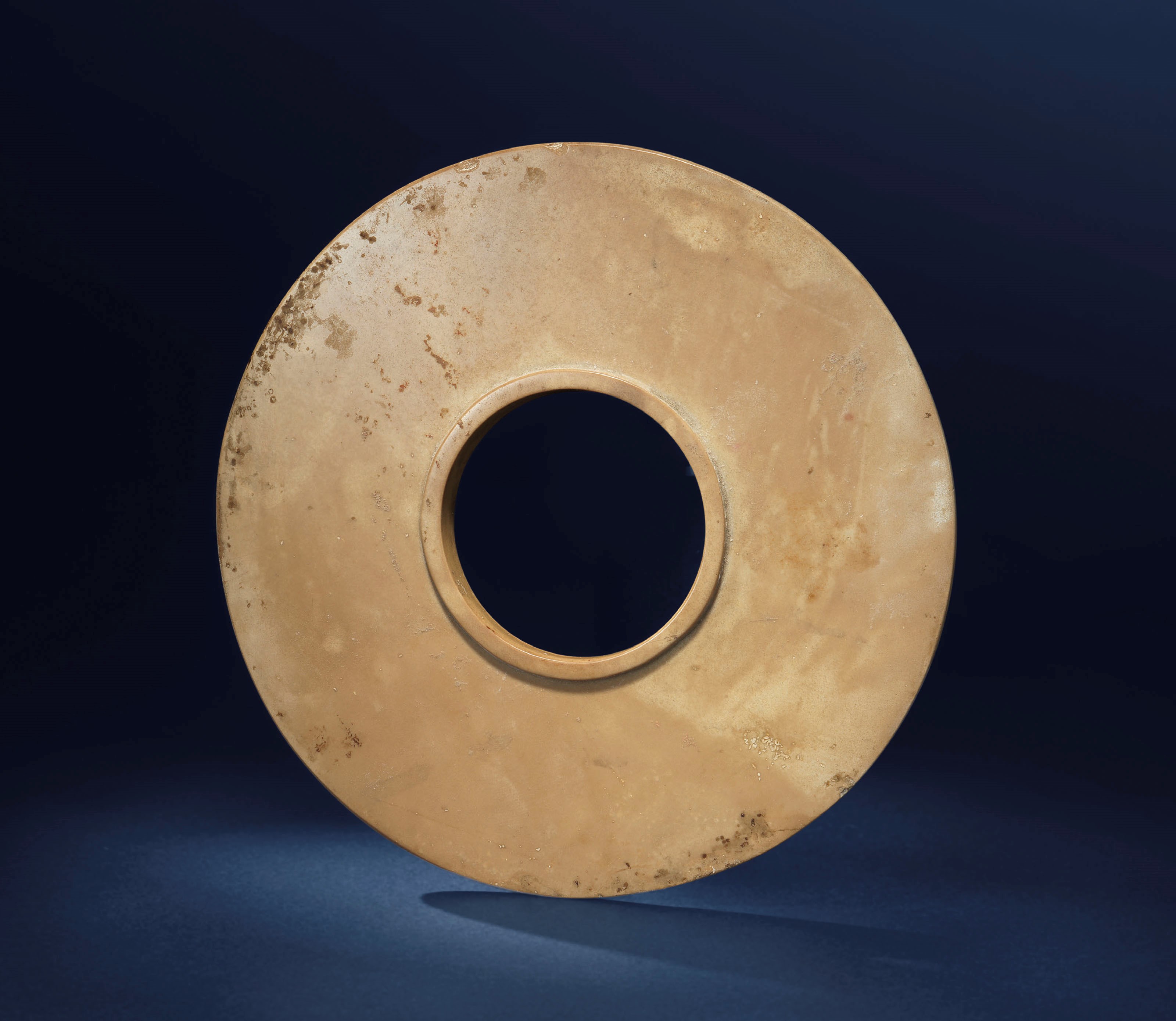 A BUFF JADE COLLARED DISC