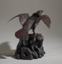 AN IRON ARTICULATED SCULPTURE OF AN EAGLE