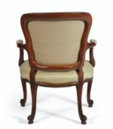 A GEORGE III SOLID MAHOGANY ARMCHAIR