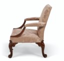 A GEORGE II WALNUT LIBRARY ARMCHAIR
