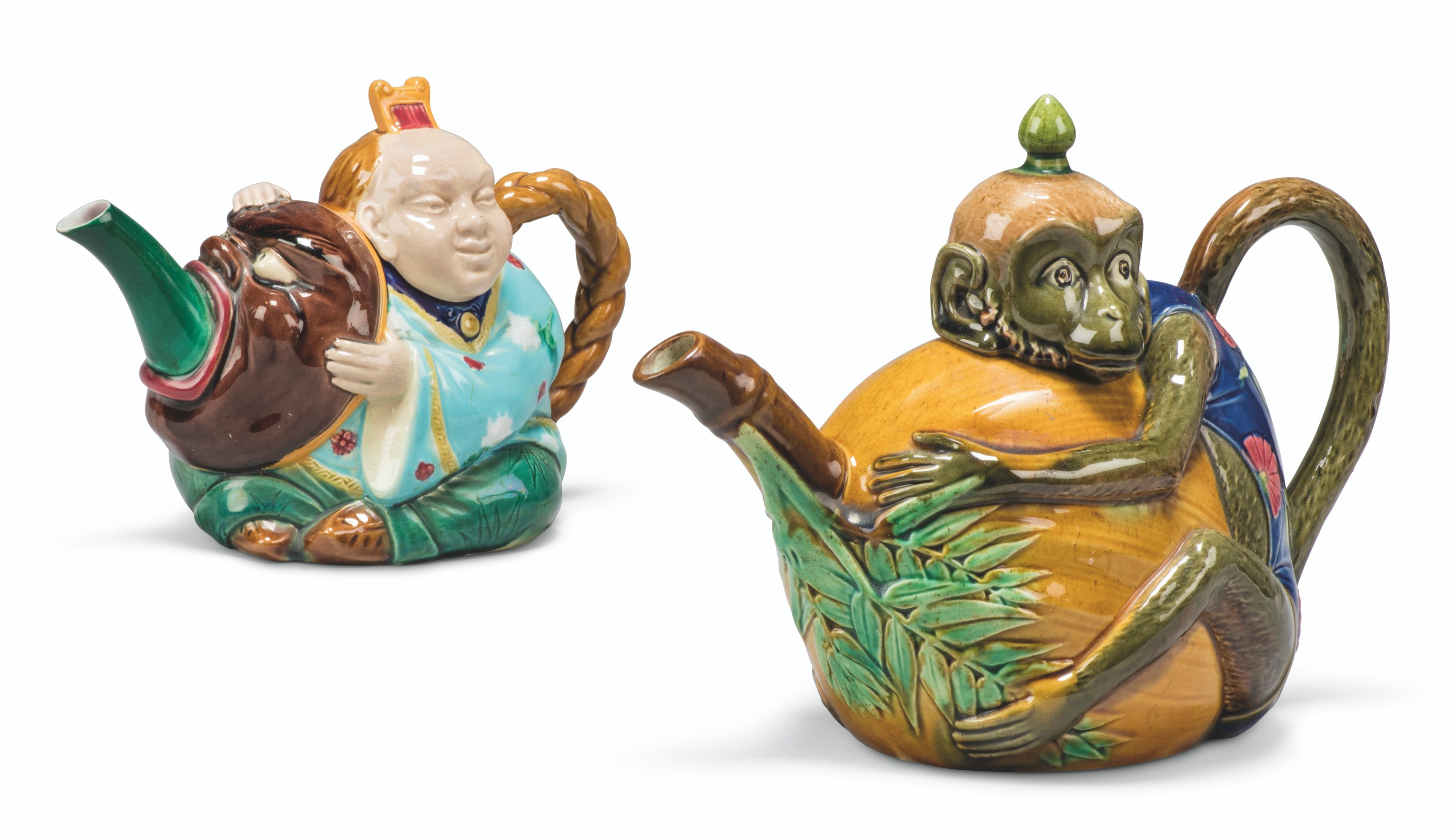 TWO MINTON MAJOLICA TEAPOTS AND COVERS