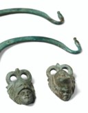 AN ETRUSCAN BRONZE SITULA HANDLE