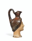 AN ATTIC POTTERY FIGURAL OINOCHOE