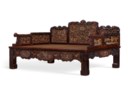 AN IMPRESSIVE POLYCHROME, GILT-DECORATED AND CARVED HONGMU LUOHAN BED