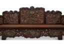 AN IMPRESSIVE POLYCHROME, GILT-DECORATED AND CARVED HONGMU LUOHAN BED