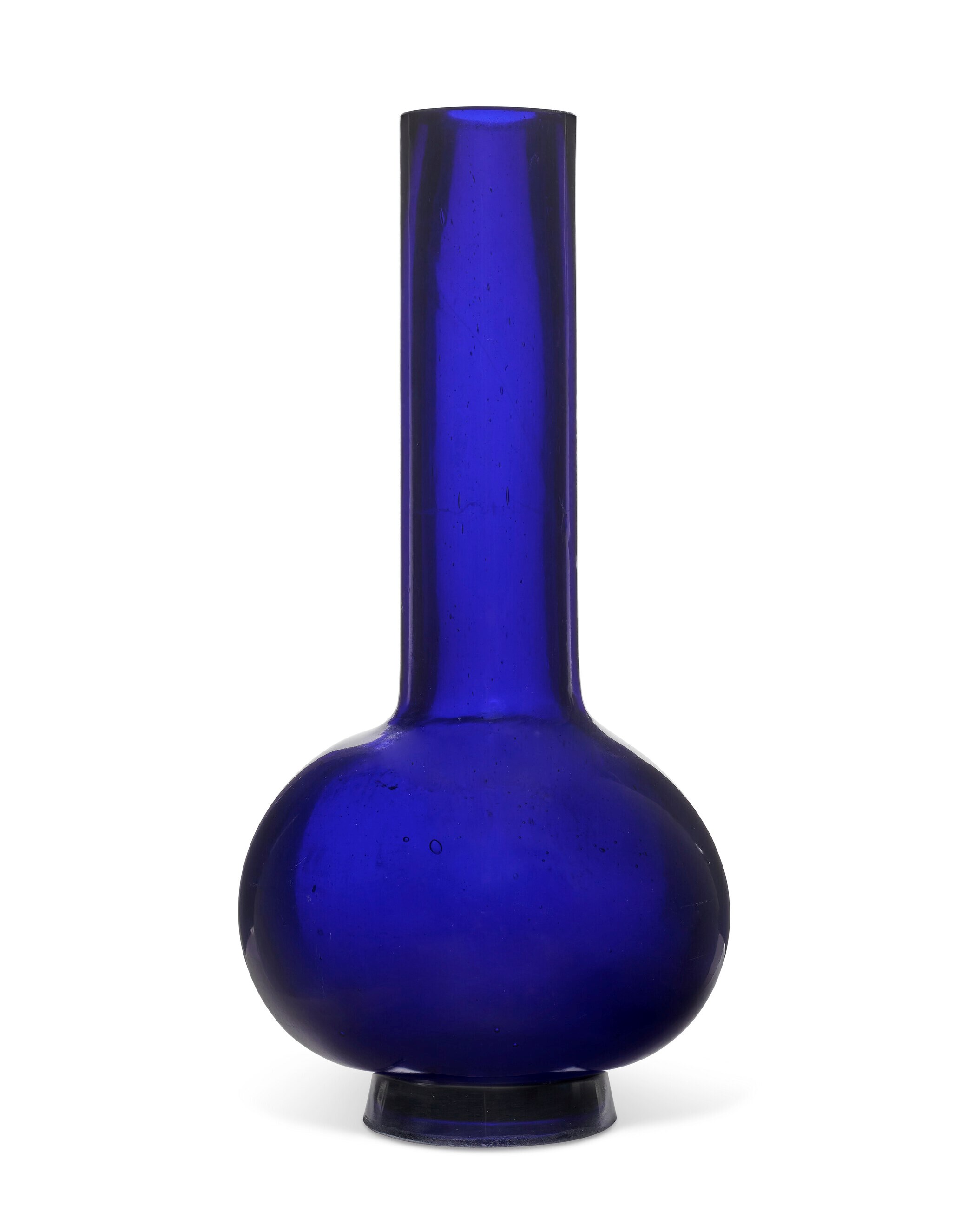 A LARGE BLUE GLASS BOTTLE VASE