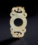 A SMALL CREAMY WHITE JADE ARCHAISTIC ORNAMENT