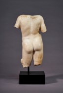 A ROMAN MARBLE TORSO OF A YOUTH