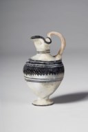 AN EASTERN MEDITERRANEAN CORE-FORMED WHITE GLASS OINOCHOE