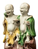 TWO CHINESE FAMILLE VERTE BISCUIT FIGURE GROUPS OF THE LAUGHING TWINS, HEHE ERXIAN