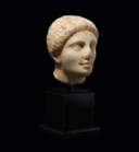 A GREEK MARBLE HEAD OF A YOUTH
