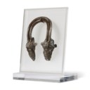 A GREEK BRONZE VESSEL HANDLE