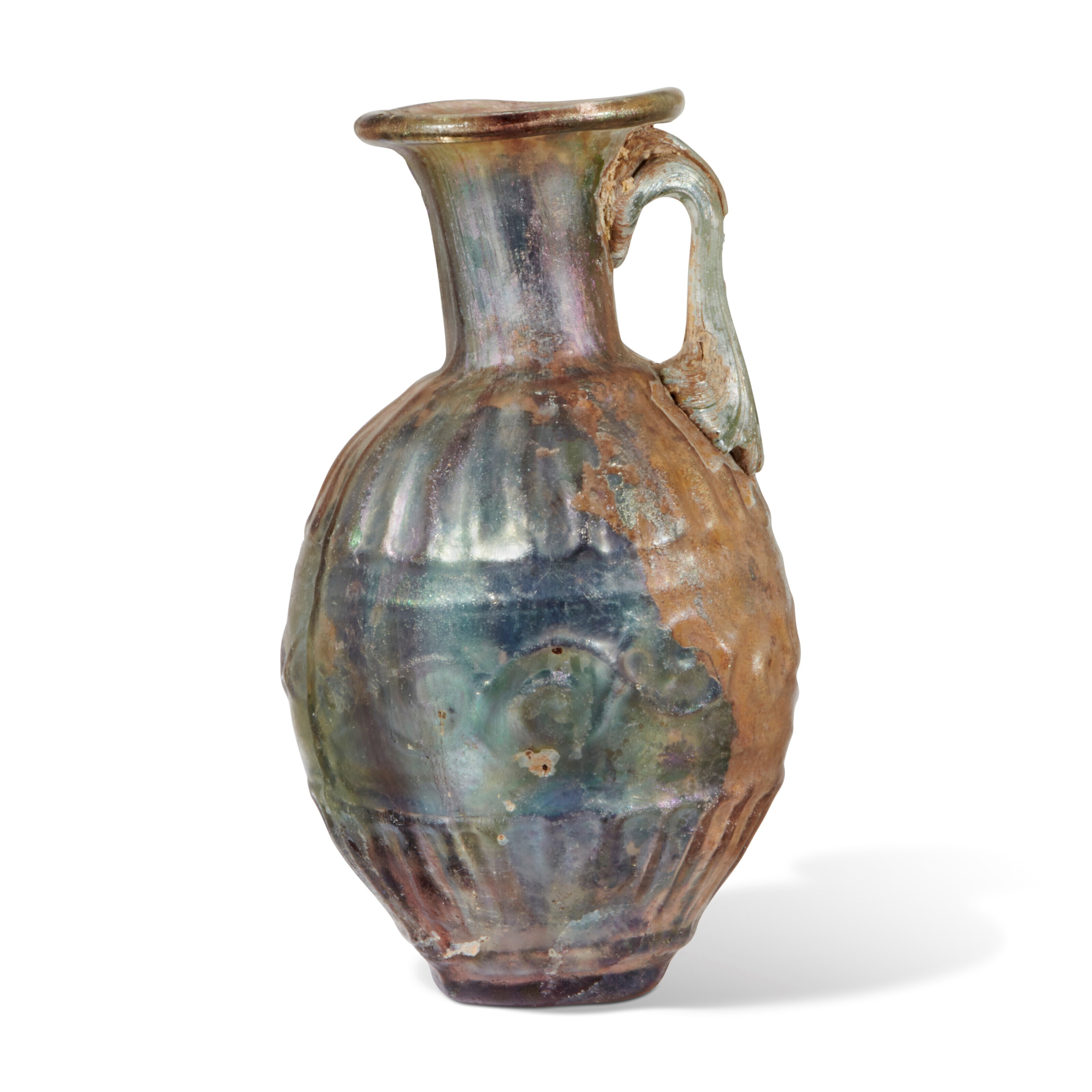 A ROMAN MOLD-BLOWN PALE GREEN GLASS JUG
