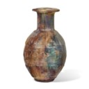 A ROMAN MOLD-BLOWN PALE GREEN GLASS JUG