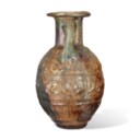 A ROMAN MOLD-BLOWN PALE GREEN GLASS JUG