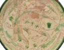 A LATE BYZANTINE GLAZED 'SGRAFFITO' POTTERY DISH
