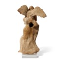 A GREEK TERRACOTTA GROUP OF APHRODITE AND EROS